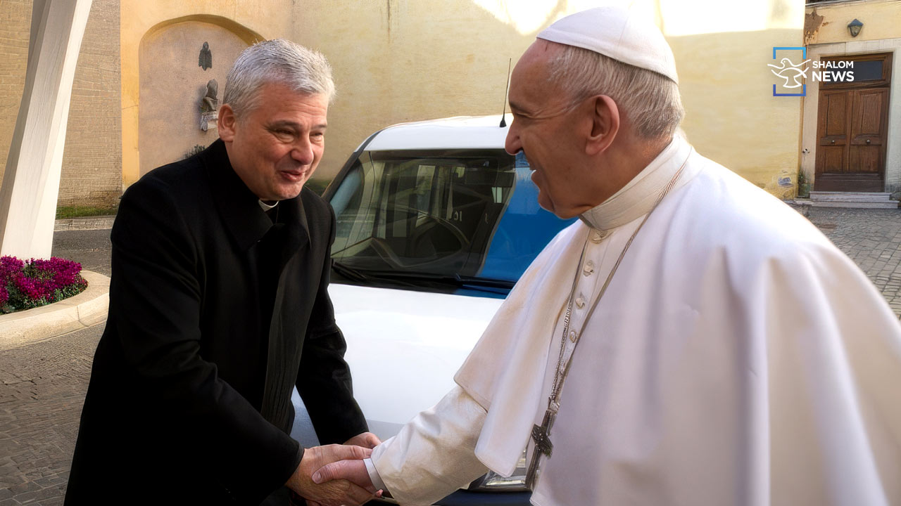 Cardinal Konrad Krajewski helping poor